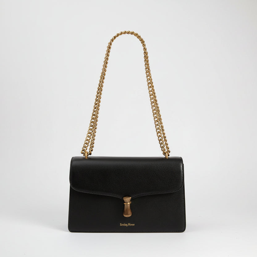 Élégant sac à bandoulière en cuir avec chaîne