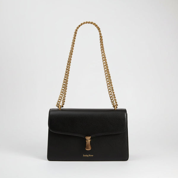 Élégant sac à bandoulière en cuir avec chaîne