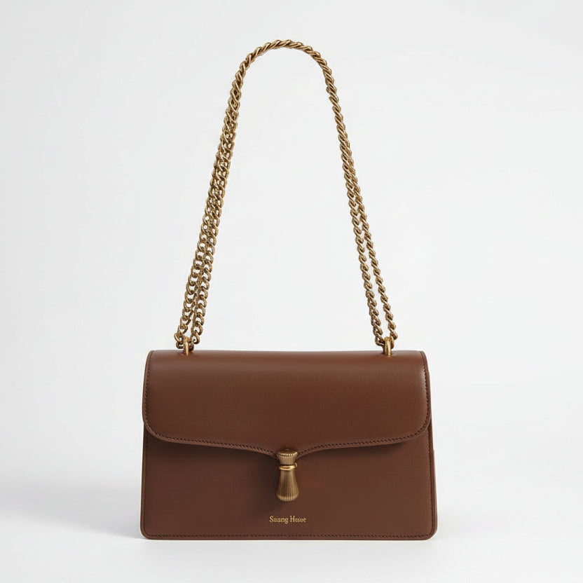 Élégant sac à bandoulière en cuir avec chaîne